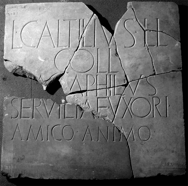 HGE34 Pompeii. May 2006. South side with window, and east side.  
According to Garcia y Garcia, a bomb fell onto the roadway near to the tomb with the marble door. This caused the partial disintegration of the bed of the road, with the breaking up and loss of five irregular blocks of the lava-stone. See Garcia y Garcia, L., 2006. Danni di guerra a Pompei. Rome: L’Erma di Bretschneider. (p.165)
