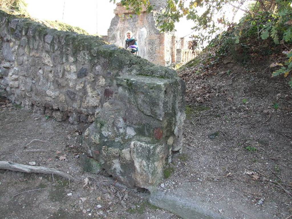 HGW05 Pompeii. December 2007. The stone wall behind and to left of pillar has been built across the Via Pomeriale. The corner was the site of a street altar. �The serpent painting stood at the intersection of the so-called Via Pomeriale and the Via dei Sepolcri near tomb 5� 
PAH 1, I, 234 (Aug 12th 1769).  See Pompeii: Scienza et Societa page 26.
