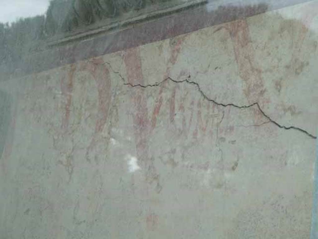 Pompeii Porta Nocera. Tomb 9ES. May 2010. Painted graffiti on east side of entrance doorway.