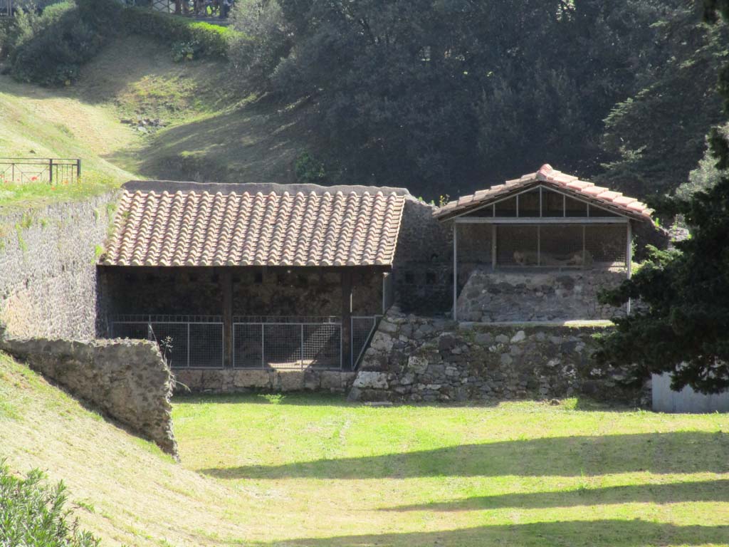 North-west side of Via delle Tombe. April 2019. Looking east towards display area showing the plaster-casts of some fleeing fugitives.
Three victims, two male and one female were found in September 1956.
A fourth victim was found in May 1957. Plaster casts were made. Photo courtesy of Rick Bauer.