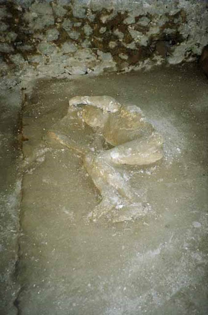 Pompeii, outside Porta Nocera. July 2010. Plaster cast of a fourth fleeing victim, found in 1956/7. Photo courtesy of Rick Bauer.