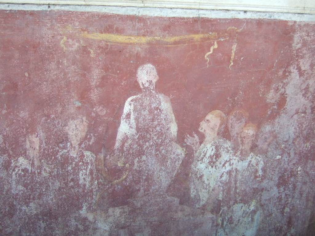 VGJ Pompeii.  May 2006.  Inner tomb east wall.  Painting of seated aedile. Engelmann describes this as �the young dignitary (aedilis) in his character of justiciary sitting on a podium;  around him several men, of which the one at his right devoutly looks up at him and lifts his right hand.� See Engelmann, W., 1929.  New Guide to Pompeii: Second Edition.  Engelmann. (p. 55).