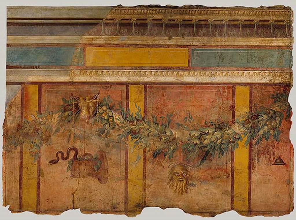 Villa of P Fannius Synistor at Boscoreale. Room L exedra/tablinum, west wall. 
Garland with Silenus mask, sacred basket, and bucrania (ceremonial bulls heads).
These are all references to the god Dionysus.
According to Barnabei, above a dark zoccolo (plinth), a metre tall, finished at the top with a white strip, large red cinnabar panels ran up the wall. 
The panels were one metre and twenty centimetres tall, and eighty centimetres wide. 
These red panels were separated by yellow stripes, about fifteen centimetres wide. 
The red panels were surrounded by a narrow band of brown. 
See Barnabei F., 1901. La villa pompeiana di P. Fannio Sinistore. Roma: Accademia dei Lincei. p. 39-46.
Photo � The Metropolitan Museum of Art, Rogers Fund 1903. Inventory number 03.14.4.
See www.metmuseum.org
