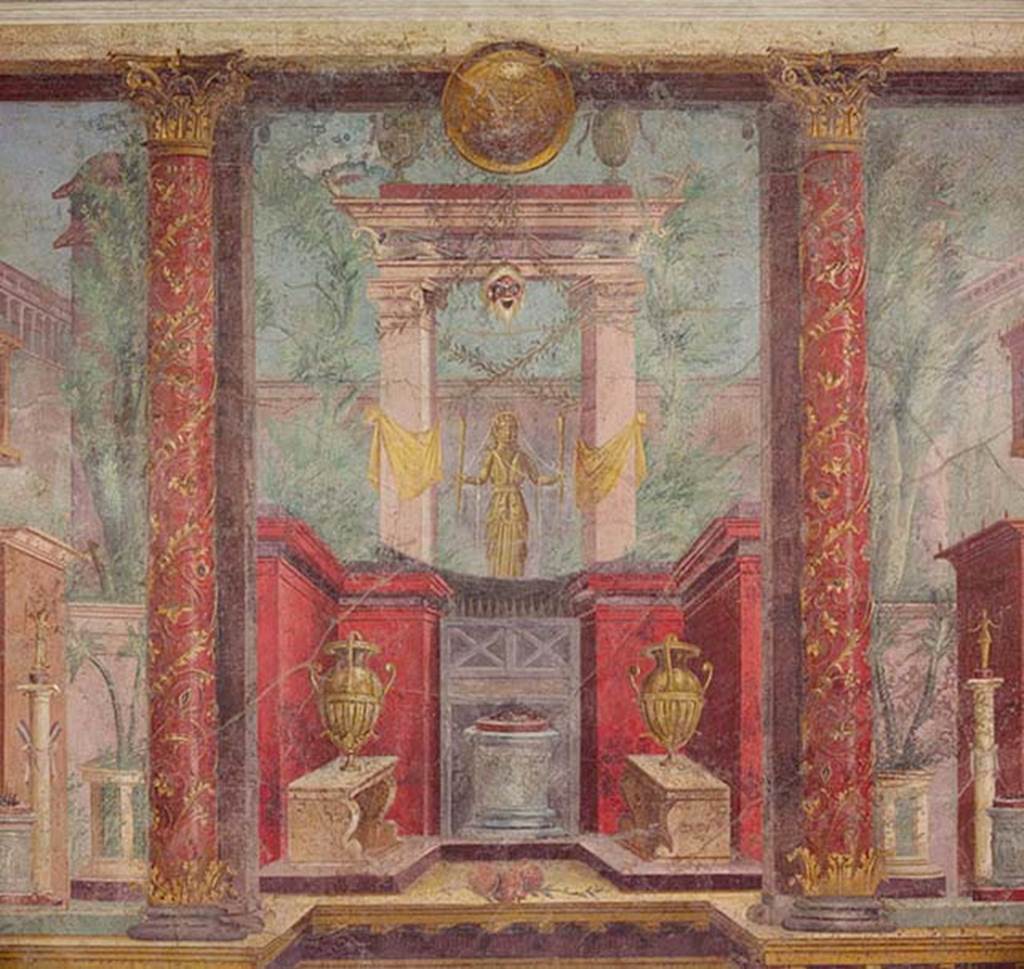 Villa of P Fannius Synistor at Boscoreale. Cubiculum M, second panel from south end of west wall. According to Barnabei, this wall painting depicts a golden statue of Diana Hecate bearing torches. She was the goddess who scattered her benefits on the end of life on those who protected it. She welcomed them, in peace underground, among the ranks of the blessed in the happiness of Elysium. In the painting she has a gold crown with serpents� heads and necks on the top. Her chest was crossed by a white band to which was attached the quiver, visible behind the right shoulder. She is within a sacred portal wrapped in yellow ribbons. From the portal hangs a bearded mask of an old silenus above which a lintel is supported on the wings of two swans. On top of the lintel are two silver urns and between them is a round gold shield. At the base is a small red walled area with an altar with offering on top and two vases on benches. Either side are red columns painted with flowers and climbers. See Barnabei F., 1901. La villa pompeiana di P. Fannio Sinistore. Roma: Accademia dei Lincei. p.74, Fig. 17.