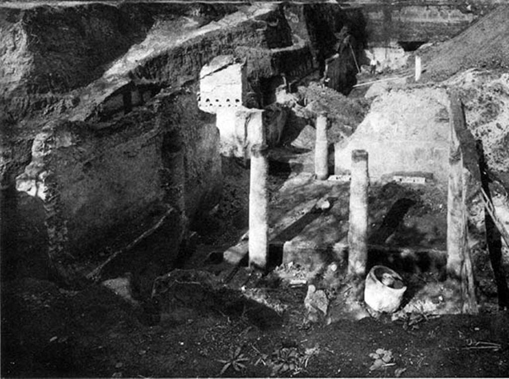 Villa of P. Fannius Synistor at Boscoreale. Room 24, work area during reburial in Mid September 1900.
According to Barnabei, the whole building was the owner�s house, except a portion (room 24) to the left of the entrance, which was used for the business.
A press for the grapes was discovered here, as well as a pitcher for the must.
An olive press (trapetum), a wine press (torcularium) and farming tools were found here.
There were also some bronze vessels, one of which had a handle of a figurine representing Bacchus, clad in silver leaf.  
See Barnabei F., 1901. La villa pompeiana di P. Fannio Sinistore. Roma: Accademia dei Lincei. Tav. XI.

 
