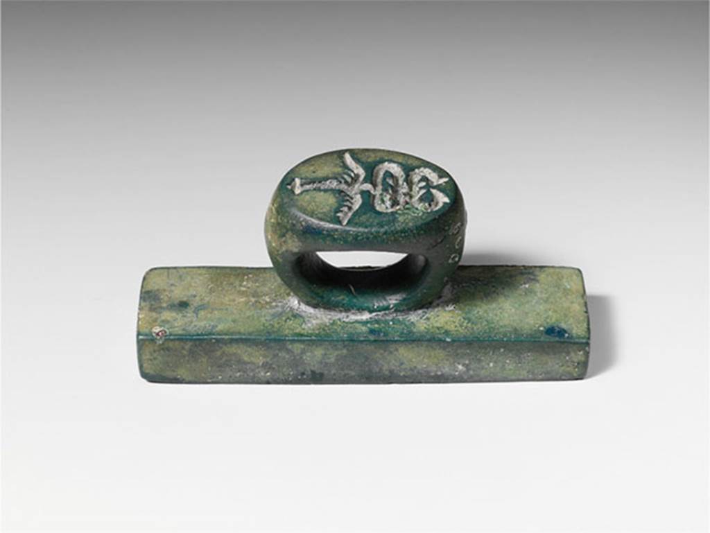 Villa of P Fannius Synistor at Boscoreale. Bronze seal and stamp engraved L. HER. FLO. According to the Metropolitan Museum New York, on the ring in intaglio (carved) is a second seal in the form of a winged caduceus, the staff of Mercury, god of commerce. Many such bronze seals have been found in the excavations at the nearby towns of Pompeii and Herculaneum, although stamps with intaglio on both ring and plate are less common. 
Photo � The Metropolitan Museum of Art, Fletcher Fund 1930. See www.metmuseum.org