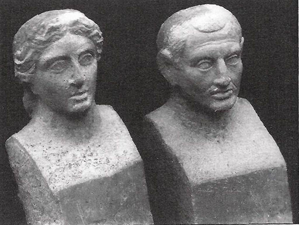 Pompeii, Villa rustica nel Fondo di Antonio Prisco. Tomb “D”.
Two travertine portraits busts found in a semi-circular niche on the west side of the tomb.
If the funeral title tablet had been recovered, we would have known who was portrayed in the two travertine busts, found in a special semi-circular niche 0.90m high; opened just below the mentioned marble slab. The two interesting portraits depict certainly the resemblance of the couple who provided for the erection of the monument; but, having to be exposed rather high up, the busts were not finished but here and there they were only sketched: the trunks were shaped as herms: 0.73m high.
In the east wall, 1.50 m above the ground, was the door, monolithic, of Vesuvian stone, mounted between threshold, architrave and door-jambs equally monolithic and of the same stone, 0.80 m high. The door-jambs being slightly inclined at the top, the door, which opened from the outside in, appeared pyramidal externally.
The interior of the tomb, a columbarium (a place for the respectful storage of cinerary urns) all covered with white stucco, consisted of two floors, the higher at the height of the threshold of the door, the lower, about 2 m underneath the first, and accessible by a central hatch of 0.70 m at the side.
In the upper floor, in each corner was embedded a terracotta pot over a small masonry pedestal; at the same level a channel was open along the walls; in the western wall two circular openings, opened above the mentioned channel, communicating with the exterior; in the opposite eastern and western walls are two semi-circular niches, 0.60 m high.
The lower floor was a columbarium of thirty-two niches, presenting eight semi-circular niches on each wall, arranged in two superimposed orders. Of the pots, and the remains they held, only a few fragments were found, because the columbarium had already been disturbed a long time ago, from searchers who penetrated from the tholos, which was probably not fully covered over by the 79AD eruption, demolishing the solid masonry.
See Stefani G., 1998. Pompei oltre la vita: Nuove testimonianze dalle necropoli, p. 106-8.
See Della Corte M., Notizie degli Scavi di Antichità, 1921, p. 416, fig. 4.