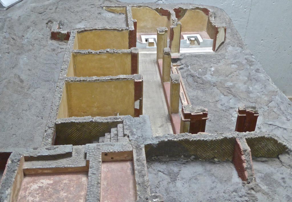 Complesso dei triclini in località Moregine a Pompei. Earlier model with triclinium D and triclinium E shown at far end undecorated but with their triclinii.
The walls of A, B, and C are shown without their frescoes. The kitchen is still unexcavated at the top left.
Photo courtesy of Michael Binns.