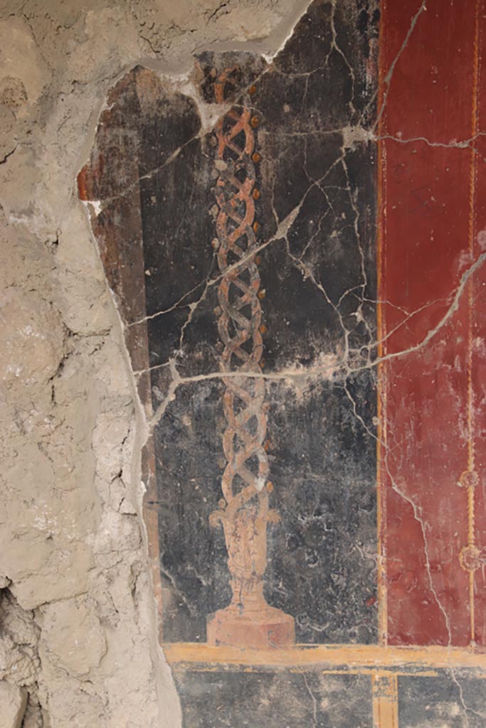 Oplontis Villa of Poppea, May 2024.   
Portico 40, detail of painted decoration of twisted candelabra from west wall, in north-west corner.
Photo courtesy of Klaus Heese.

