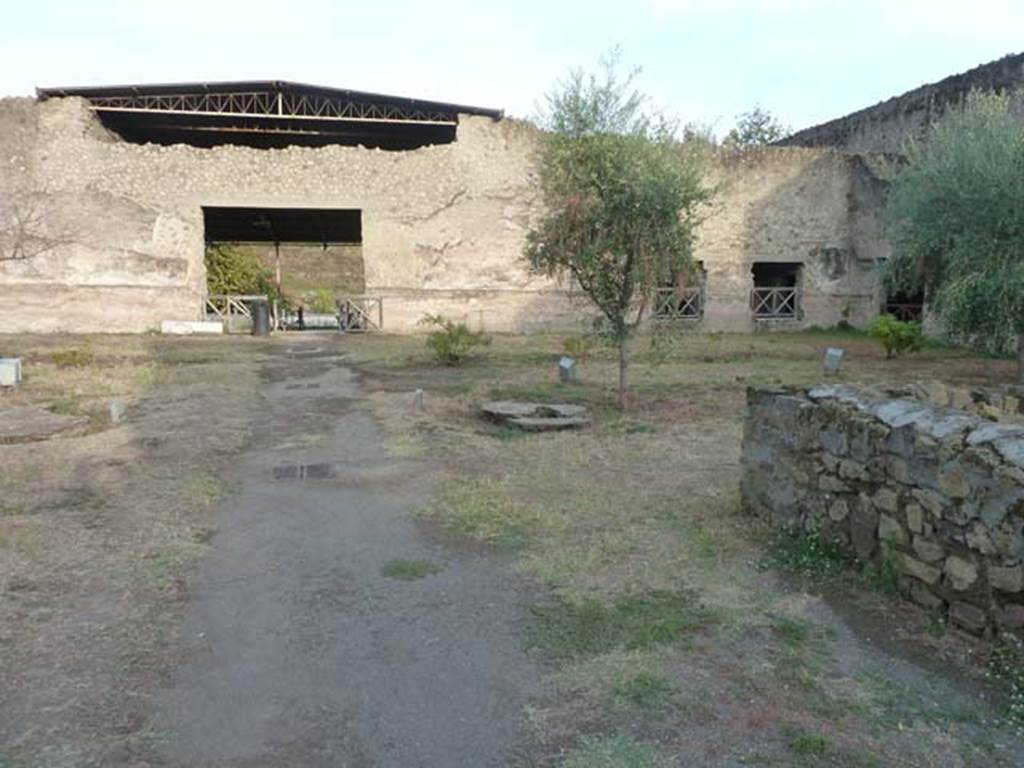 Oplontis Villa of Poppea, September 2015. Looking east towards east side of north garden 56, along the pathway to Exedra 69.
Another Wilhelmina Jashemski plaster-cast can be seen on the centre-right.
The wall on the right is part of room 58, in which she also found root-cavities.