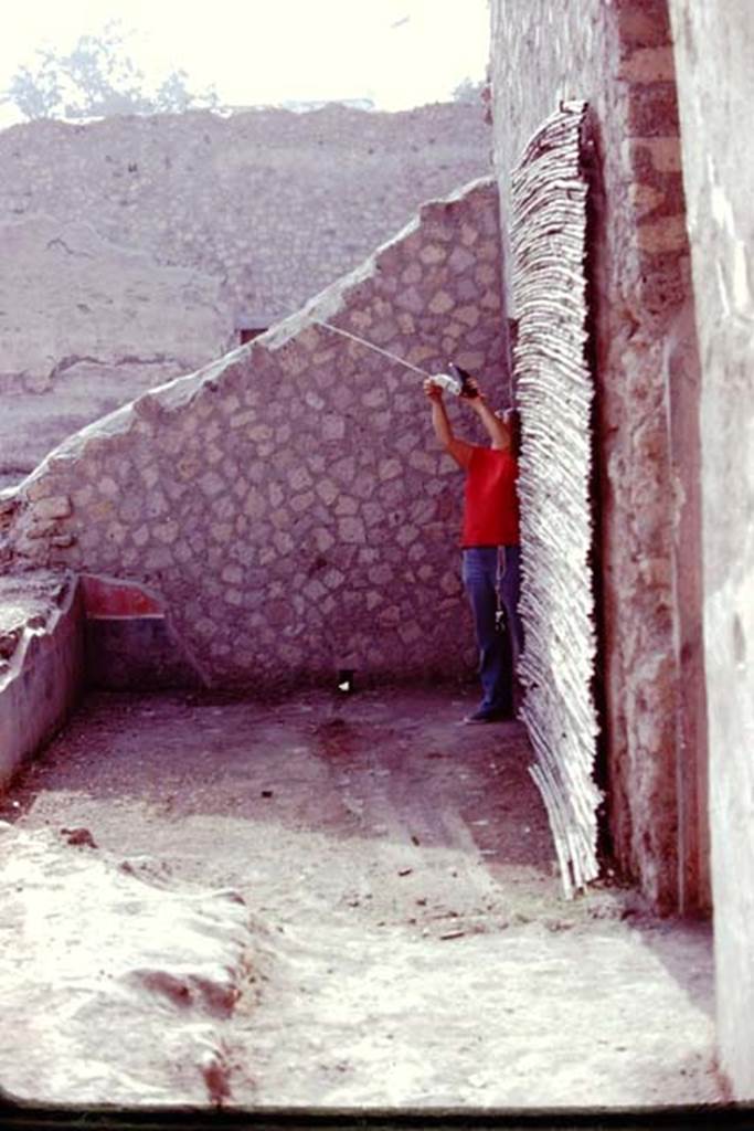 Oplontis, 1977. Room 57, looking east towards the remains of black and red painted plaster on the sloping reconstructed wall. Photo by Stanley A. Jashemski.
Source: The Wilhelmina and Stanley A. Jashemski archive in the University of Maryland Library, Special Collections (See collection page) and made available under the Creative Commons Attribution-Non Commercial License v.4. See Licence and use details. J77f0292