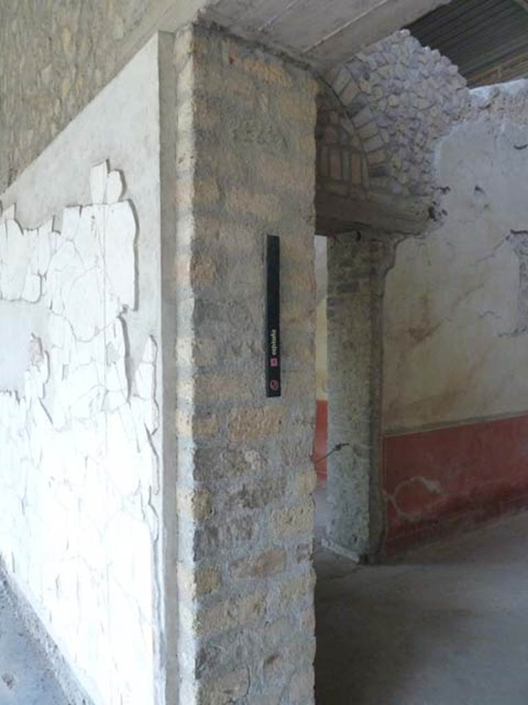 Oplontis, September 2015. Room 90, south pilaster with marker indicating room 90 was one of a group of rooms set aside for guests, indicated by the sign “ospitalia”.
