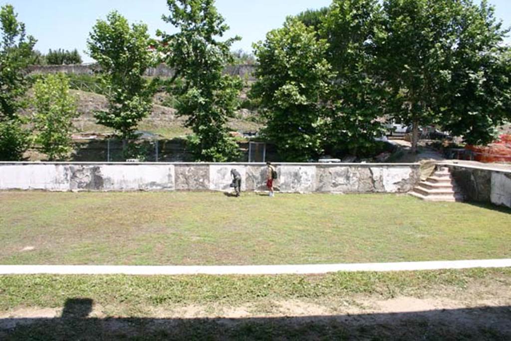 Oplontis Villa of Poppea, June 2008. Room 96, the swimming pool, looking east from 60 (with area 80 in the foreground of the image delineated by the white marble strip).
In the far right, south east, corner are the steps into the pool.
Photo courtesy of Martin Blazeby.