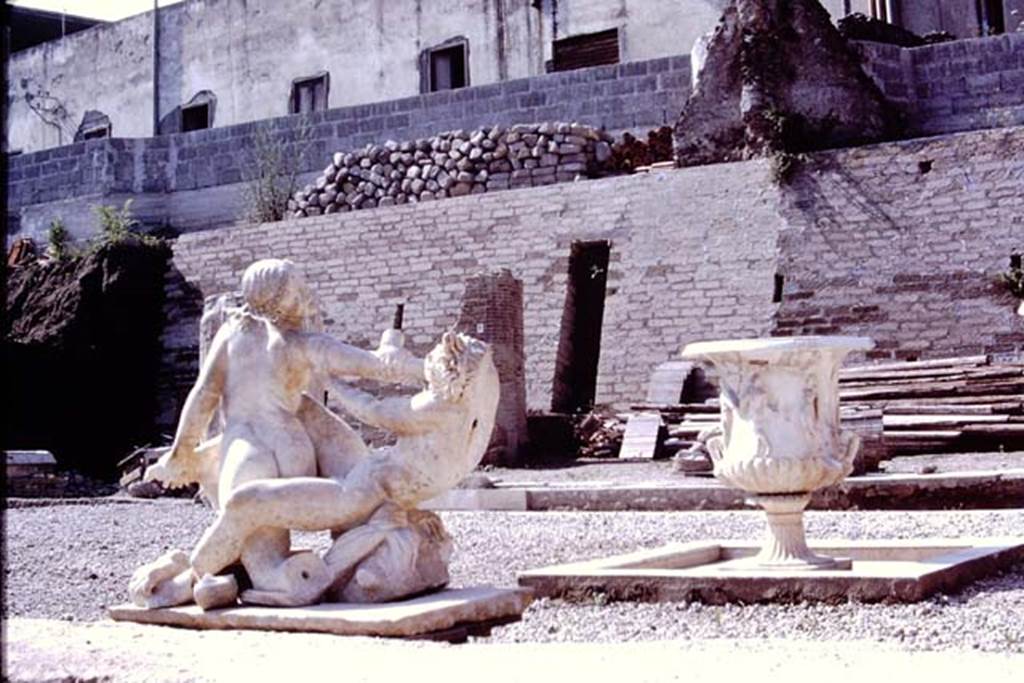 Oplontis, 1978. Marble group of hermaphrodite and a faun, also recently discovered on the south side of the pool. Photo by Stanley A. Jashemski.   
Source: The Wilhelmina and Stanley A. Jashemski archive in the University of Maryland Library, Special Collections (See collection page) and made available under the Creative Commons Attribution-Non Commercial License v.4. See Licence and use details. J78f0050
