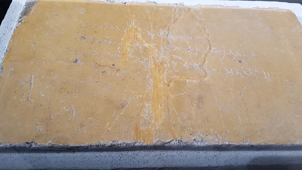 Stabiae, Villa Arianna. August 2023.
Room 21, erotic graffito cut from west wall, on display in “Arte e sensualita nelle case di Pompei” in Palestra. Photo courtesy of Maribel Velasco.
Now in Stabia Antiquarium, inventory number 65179.