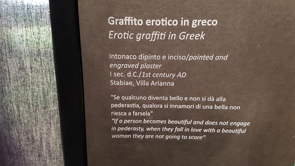 Stabiae, Villa Arianna. August 2023.
Room 21, description card for erotic graffito cut from west wall. Photo courtesy of Maribel Velasco.
