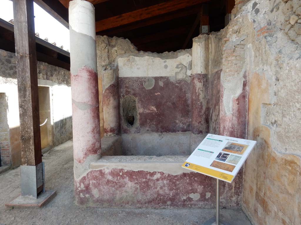 Stabiae, Villa Arianna, June 2019. Room 21, looking south to square pool. Photo courtesy of Buzz Ferebee.
In the west wall, on the right, traces can be seen from where the graffito found on 22nd September 1965 was cut from.
According to Napolitano, in D'ORSI's excavation diary, Gli scavi di Stabiae, p. 364, we read –
“on 21 September 1965, Tuesday, during excavation works in the kitchen and bath area, on the western wall of a probable atrium, 0.70 m from the crest of the wall, 1.82 m more to the south of the left pillar of the entrance to the kitchen, 1.10 m wide, and 0.50 m further north of the first column of the western side of the impluvium with a high masonry pluteus, a graffito was brought to light, in Greek, consisting of a total of four lines 0.21 m long”.
See Napolitano, M. C. and Puglia, E., 2014. Novità su due graffiti greci da Stabiae. Papyrologica Lupiensia, N. 23, p. 59ff, note 22, fig. 6.