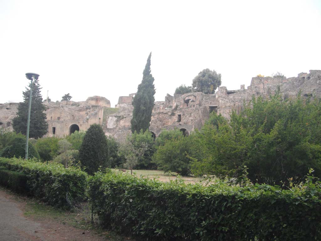 Pompeii, south side. May 2011.
Looking north-west towards Temple of Venus, on upper left, VIII.2.A, centre left, and rear of houses in VIII.2, on right.
Photo courtesy of Ivo van der Graaff.